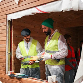 Installers carrying large panels for a window covering project